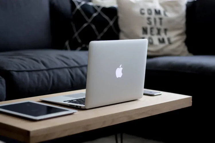 laptop coffee table blue sofa